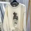 Пуловер с мече и кариран акцент - снимка 3